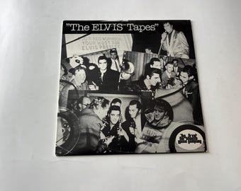 May include: A black and white photo collage of Elvis Presley and his band. The text "The Elvis Tapes" is at the top of the collage. The text "Jor Red Robinson Your Host For Elvis Presley" is in the center of the collage. The text "Elvis Pre Show" is at the bottom of the collage. The text "The Great Music Company" is in a circle at the bottom right of the collage.