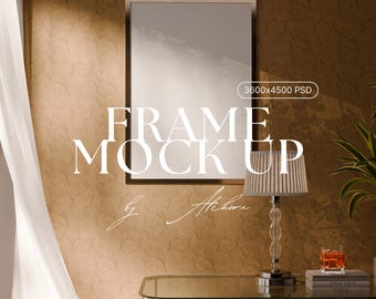 May include: A framed art mockup with the text "FRAME MOCK UP" in a serif font. The frame is hanging on a textured, patterned wall. A lamp with a striped shade and a glass table are in the foreground.