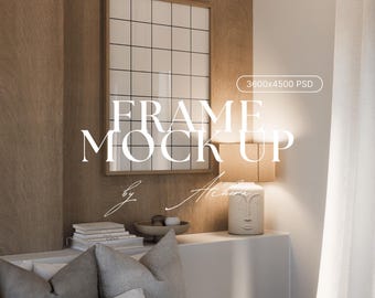May include: A framed grid mockup with the text "FRAME MOCK UP" and "by Achira". The frame is above a white surface with a lamp, books, and pillows. The background is a wooden wall.