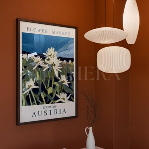 Vertical framed poster mockup in Scandinavian living room decor with warm terracotta walls, calm setting, and natural lighting. Wood frame mockup with realistic glass reflection, perfect for showcasing artwork or prints. High-quality PSD Photoshop and Photopea compatible, DIN A ratio. Ideal single frame mockup for interior mockup presentations, Modern Contemporary mockup styles, and vertical mockup designs with botanical or floral-themed art displays.