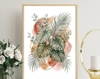 Op de afbeelding: Een ingelijste aquarelprint met tropische bladeren en abstracte vormen in groen, bruin en perziktinten. Het kunstwerk bevat monstera bladeren, palmbladeren en eucalyptus takjes, alles tegen een witte achtergrond.