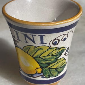 May include: A set of three ceramic mugs with a speckled, matte finish. The mugs are in shades of cream, light gray, and dark gray. Each mug has a simple, minimalist design, perfect for coffee or tea.