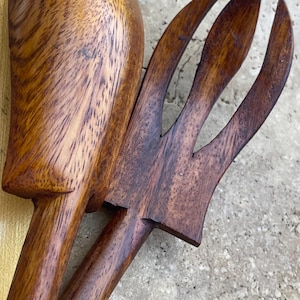 May include: A set of three ceramic mugs with a speckled, matte finish. The mugs are in shades of cream, light gray, and dark gray. Each mug has a simple, minimalist design, perfect for coffee or tea.