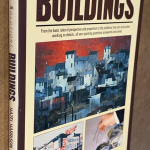 May include: A book titled "BUILDINGS" from the "PAINTING SOLUTIONS" series by Hazel Harrison. The cover features a painting of buildings with a red sky. The book's spine reads "PAINTING SOLUTIONS BUILDINGS HAZEL HARRISON".