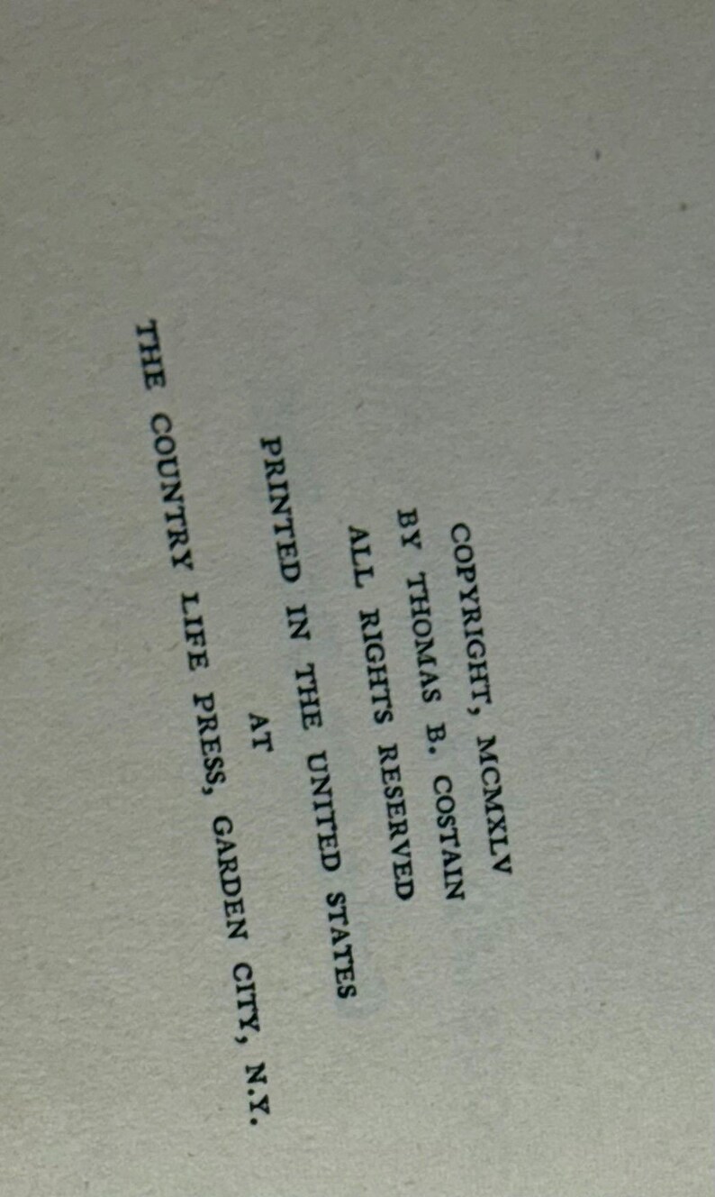 May include: A page from a book with text. The text includes copyright information, author Thomas B. Costain, and the printing location in Garden City, N.Y. The text is in black font on a light beige background.