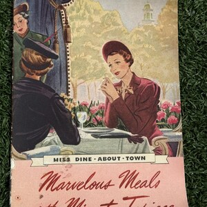 May include: Vintage magazine cover featuring a dining scene with three women. The cover has the text "Miss Dine About Town" and "Marvelous Meals with Minute Tapioca" in a script font. The illustration shows a woman in a maroon suit.