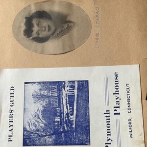 May include: An oval, sepia-toned photograph of a woman with short hair and a striped top, next to a paper with the name "Connie Conrad" printed vertically. Below is a blue and white printed program for the Plymouth Playhouse in Milford, Connecticut.
