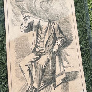 May include: Vintage Malt Bitters Puzzle illustration. The image depicts a seated figure in a suit, with a cloud obscuring the head, holding a cigarette. The text reads "Malt Bitters Puzzle" and "Who is the coming man."