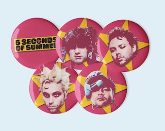 May include: A collection of five round, maroon-colored buttons featuring images of band members. Each button has a yellow starburst design in the background. One button displays the text "5 SECONDS OF SUMMER" in yellow and white.