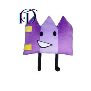 May include: A plush purple pillow shaped like a castle with a smiling face, black legs, and yellow accents. The pillow has a white mouth, black eyes, and the letters "FD" in the upper left corner.