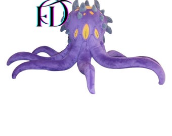 May include: A large, plush purple octopus with multiple tentacles and yellow eyes. The octopus has a spiky crown and is made of soft fabric. The image also includes the letters "FD" in a 3D style.