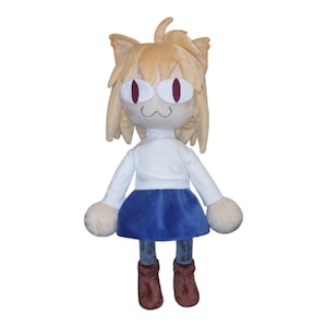 May include: A plush doll of a cat-eared character with a white shirt, blue skirt, and brown boots. The doll has tan fur, large red eyes, and a small, smiling mouth. The doll's arms and legs are rounded.