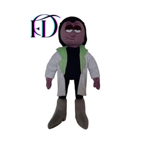 May include: A plush doll of a cartoon character, featuring a dark purple head, black hair, and a stern expression. The doll wears a white lab coat with a light green collar over a black shirt, gray boots, and purple hands. The logo "FD" is in the top left corner.