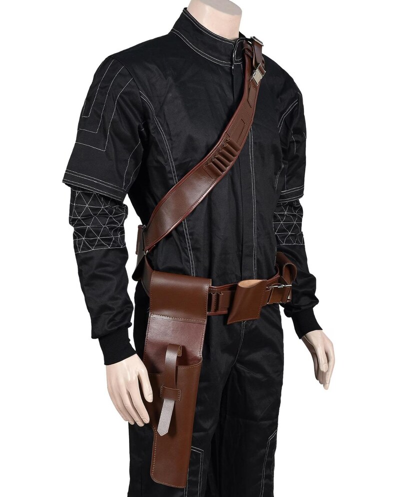 May include: A black jumpsuit with white stitching and a brown leather shoulder strap with bullet holders. A brown leather belt with pouches and a holster is also included. The outfit is displayed on a mannequin.
