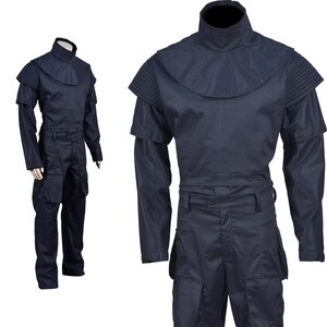 May include: Navy blue jumpsuit with a high collar and layered shoulder details. The long-sleeved garment features a fitted waist and multiple pockets on the pants. The costume is displayed on a mannequin, showcasing its design and fit.