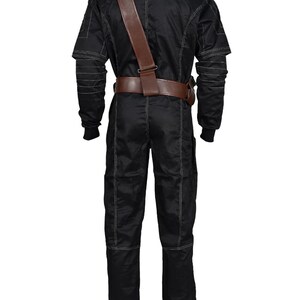May include: Black jumpsuit with white stitching details, a brown leather belt, and a matching shoulder strap. The jumpsuit has long sleeves and a high collar. The overall design is sleek and functional, suitable for cosplay or costume events.