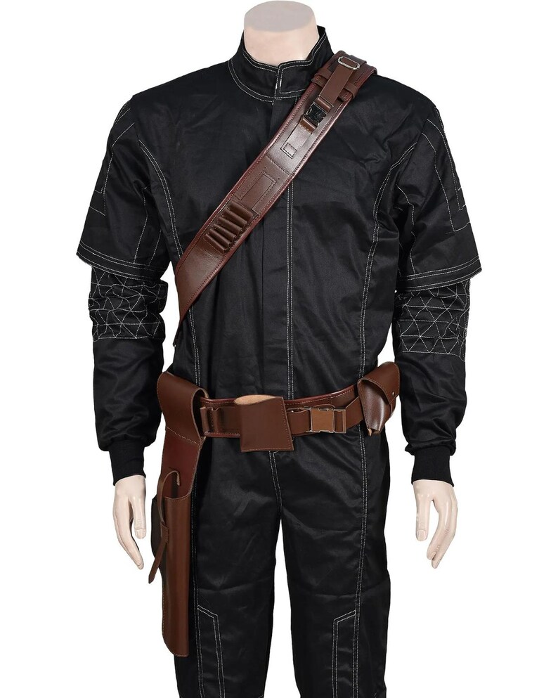 May include: Black jumpsuit with white stitching and a brown leather belt and shoulder strap. The costume includes a holster and a shoulder strap with multiple compartments. The sleeves have a geometric design.