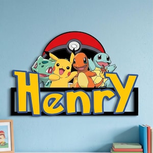 May include: A decorative wall sign featuring the name Henry in large yellow letters with blue outlines. Above the name are illustrations of Bulbasaur, Pikachu, Charmander, and Squirtle positioned in front of a red, white, and black Poké Ball.