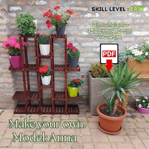 May include: A dark brown wooden plant stand with multiple shelves, holding various potted plants with red and pink flowers. The stand is 59 inches tall, 43 inches wide, and 9.5 inches deep. Text on the image reads "Make your own. Model: Anna."