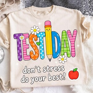 May include: A white ceramic mug with a black handle and the text "But First, Coffee" in a bold, black font. The mug is set against a blurred background, suggesting a cozy setting.