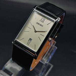Vintage Seiko Slim Tank Quartz herenpolshorloge, rechthoekig horloge - wit en zwart horloge. Seiko vintage wijzerplaat.