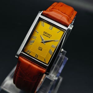 Vintage Seiko Slim Tank Quartz Herren Armbanduhr, Rechteck Uhr-Braun & Gelbe Uhr.