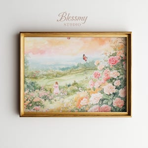 Op de afbeelding: Een ingelijste aquarelprint met een serene landschap met een figuur in een roze jurk, omringd door rozen en vlinders. Het kunstwerk heeft een gouden lijst en de tekst "Blessmy STUDIO" linksboven.