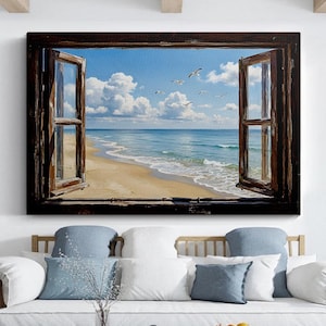 May include: A rectangular wall art print featuring a view through an open, dark brown wooden window frame. The scene depicts a sandy beach, turquoise ocean waves, and a bright blue sky with white clouds and several birds flying in the distance.