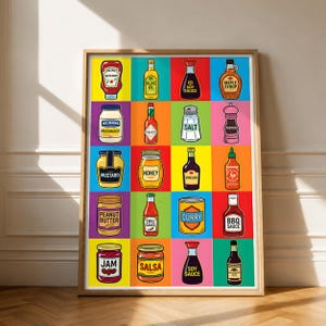 May include: A framed wall art print featuring a grid of twenty colorful illustrations of various food condiments and pantry staples, including ketchup, olive oil, soy sauce, maple syrup, mayonnaise, hot sauce, salt, pepper, mustard, honey, vinegar, and BBQ sauce.