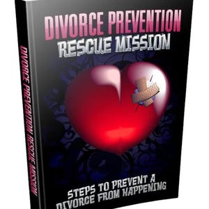 May include: A book cover with the title "DIVORCE PREVENTION RESCUE MISSION" in pink and silver lettering. A red heart with a bandage is centered on the cover. The book's spine also displays the title. The subtitle reads "STEPS TO PREVENT A DIVORCE FROM HAPPENING."