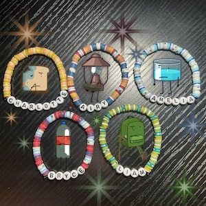 May include: Five colorful beaded bracelets with cartoon character designs and names spelled out in white letter beads. The bracelets feature a map, a lantern, a glass of water, a bottle, and a backpack.