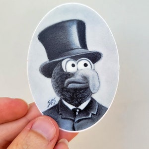 May include: A black and white illustration of a character wearing a top hat and a suit. The character has large eyes and a serious expression.