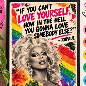 May include: A framed A5 print measuring 148 x 210mm featuring a black and white portrait of RuPaul with a rainbow background. The text reads, "If you can't love yourself, how in the hell you gonna love somebody else?" - RuPaul. The print is on 250gsm card.