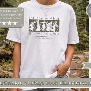 May include: A white short-sleeved t-shirt featuring a dark green rectangular graphic with a vintage illustration of five figures. The text reads let the mother go out to play and Charlotte Mason. The shirt has a crew neckline and a loose fit.