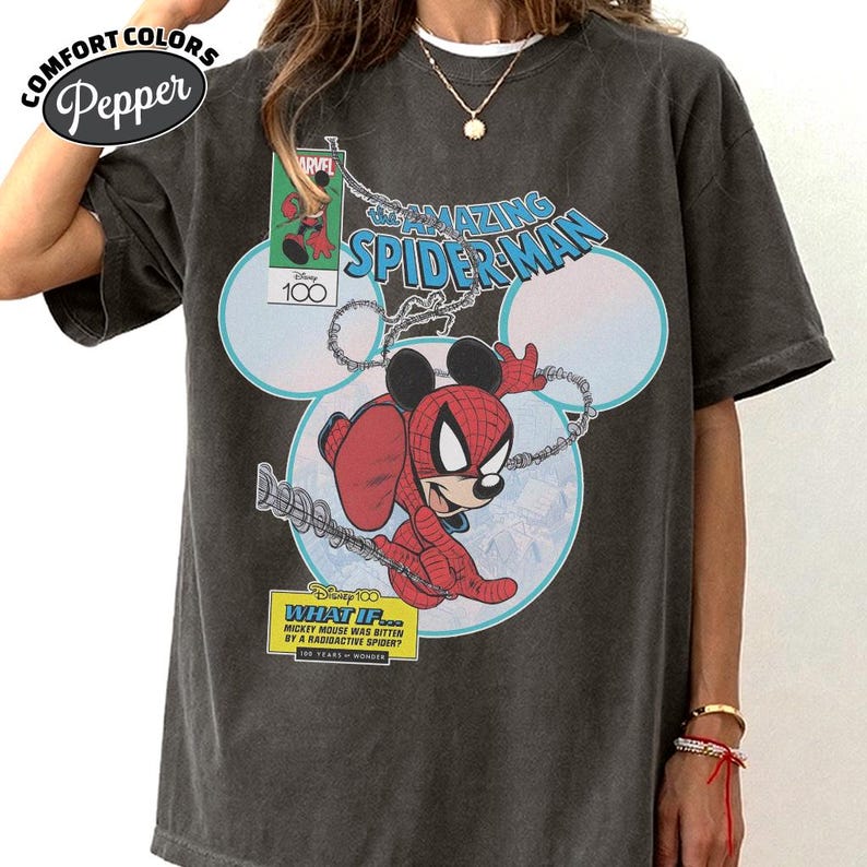 May include: Dark gray Comfort Colors t-shirt featuring a graphic of Mickey Mouse as Spider-Man. The design includes the text "The Amazing Spider-Man" and "What If... Mickey Mouse was bitten by a radioactive spider?"