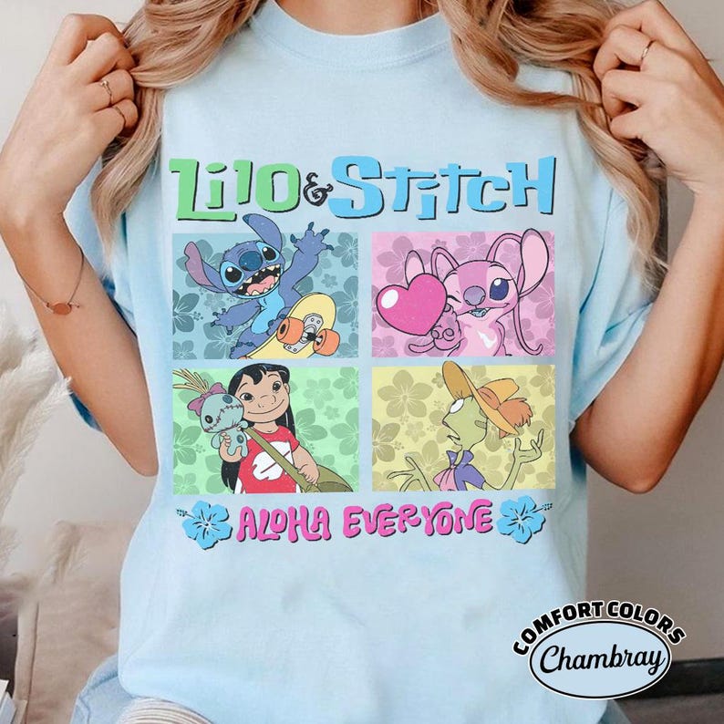 May include: Pale blue t-shirt with the words "Lilo & Stitch" and character illustrations in squares. The shirt also has the text "Aloha Everyone" and a Comfort Colors logo.