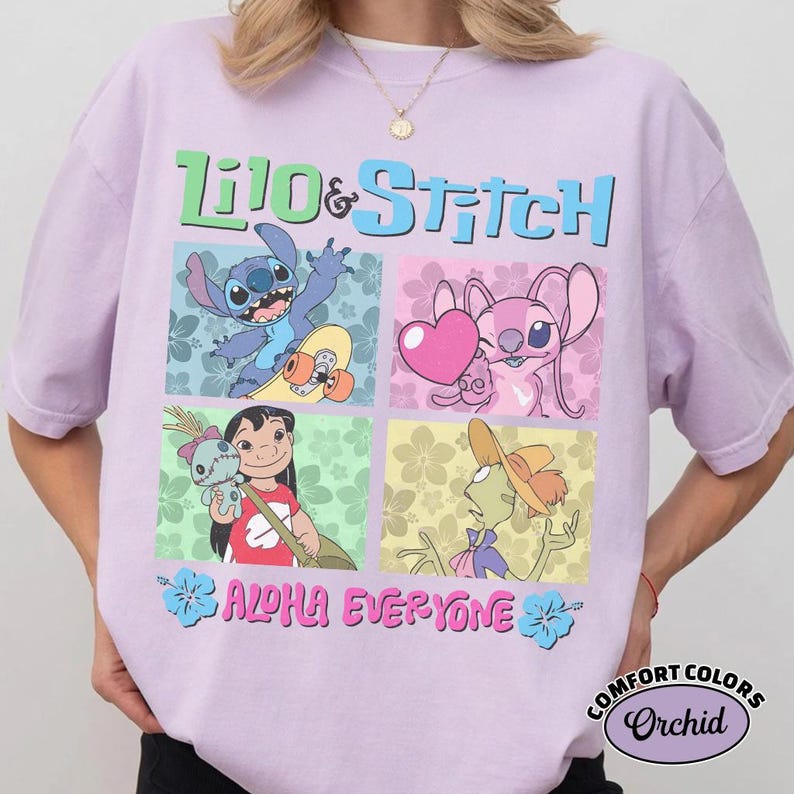 May include: A lilac t-shirt with a colourful graphic of Lilo & Stitch characters. The design includes the words "Lilo & Stitch" and "Aloha Everyone". The shirt is a Comfort Colors Orchid.