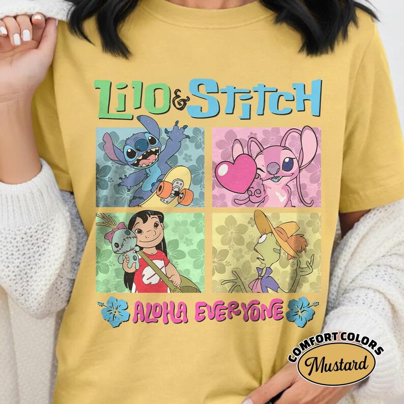 May include: Mustard yellow t-shirt with a vibrant Lilo & Stitch design. The graphic showcases Stitch, Angel, Lilo, and Jumba in square panels. Text includes "Lilo & Stitch" and "Aloha Everyone". The t-shirt is a Comfort Colors brand.