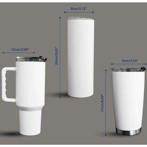 May include: Three white insulated tumblers with black lids are displayed. The tumbler on the left has a handle and is 10cm wide. The center tumbler is 24cm tall and 8cm wide. The tumbler on the right is 17cm tall and 9cm wide.