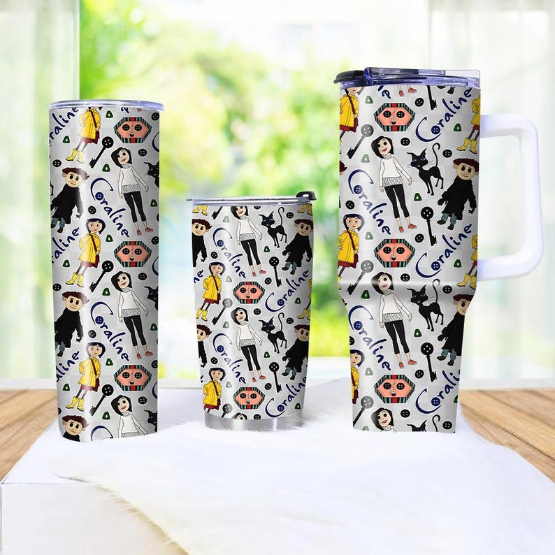 May include: Three stainless steel tumblers with a repeating pattern featuring characters and text from the movie "Coraline." The design includes a girl, a black cat, keys, and the text "Coraline" in a blue script. The tumblers are in different sizes.
