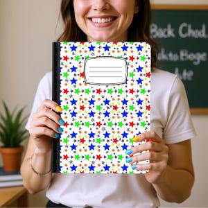 May include: A rectangular notebook with a white cover featuring a repeating pattern of blue, red, green, and orange stars of varying sizes. The cover includes a central white rectangular label with three horizontal black lines for writing.