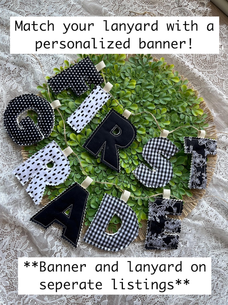 May include: A fabric banner spelling FIRST GRADE with individual stuffed letters in black and white patterns including polka dots, gingham, and floral prints. The text Match your lanyard with a personalized banner! and **Banner and lanyard on seperate listings** is visible.