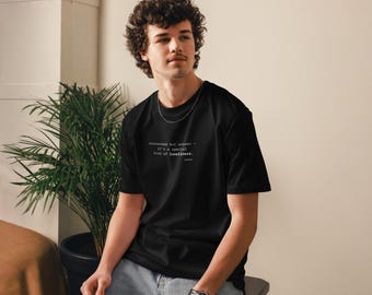 May include: Black t-shirt with the text "misunderstood but unseen - it's a special kind of loneliness." The shirt is a crew neck and is being worn by a person. The person is wearing a silver chain.