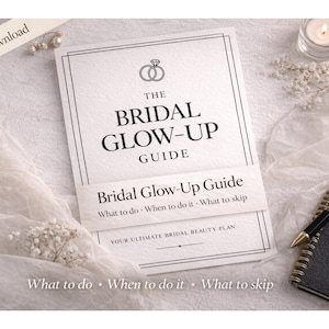 May include: A bridal guide titled "The Bridal Glow-Up Guide" with the text "What to do, When to do it, What to skip." The cover features a ring icon. A notebook, pen, and candle are also visible.