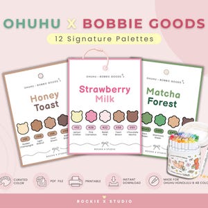 May include: Ohuhu x Bobbie Goods 12 Signature Palettes set featuring three colour swatch cards labelled Honey Toast, Strawberry Milk, and Matcha Forest with bear-shaped colour samples, alongside a container of markers and a pen.