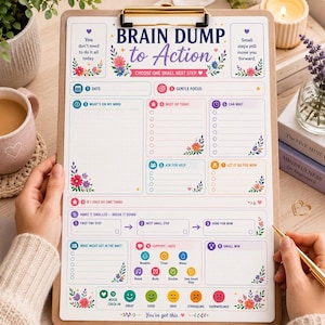 May include: A clipboard holding a Brain Dump to Action planner sheet with floral accents. The page includes sections for date, focus, tasks, and mood tracking. Text includes 'You don't need to do it all today' and 'Small steps still move you forward.'