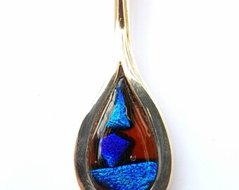 Handmade 925 silver surround dichroic pendant.