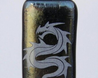 white enamel dragon on special black glass pendant.