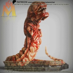 May include: A 3D-printed model of a worm-like creature, featuring a detailed design with brown and red hues. The model has a large, open mouth with teeth. The image includes text with a website address and the word "PATREON".