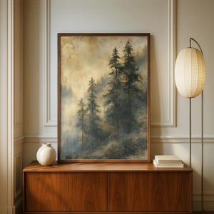 May include: A framed vertical wall art print depicting a misty forest scene with tall evergreen trees in shades of dark green and muted brown against a hazy, golden-toned sky, presented in a simple dark wood frame with a clean, rectangular design.